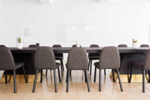 An office that has chairs and and a table right after cleaning