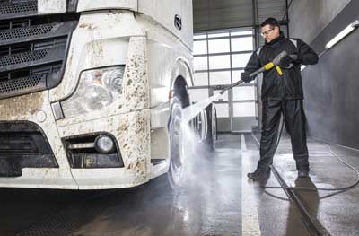 Power washing a delivery HGV truck