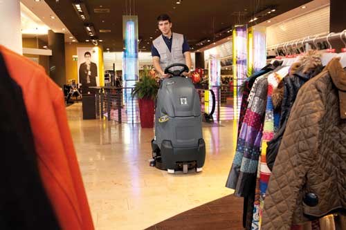 Step on scrubber dryer in a shop