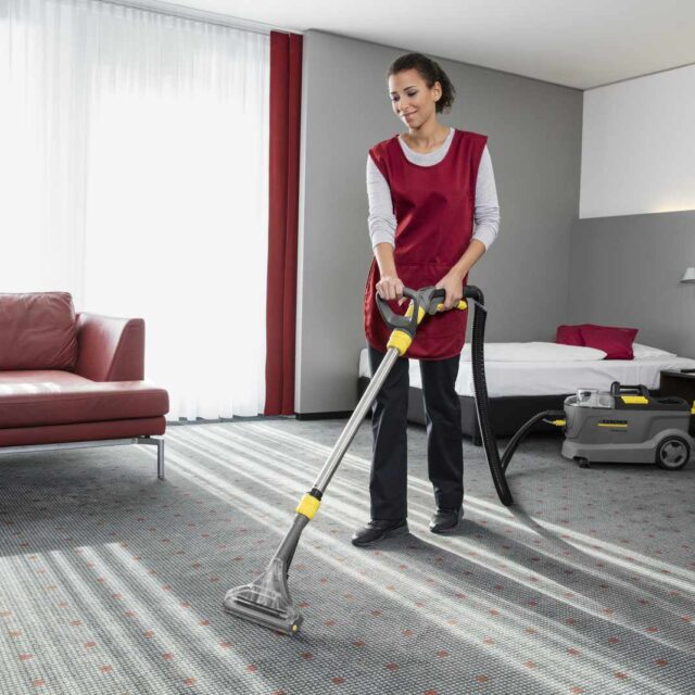 Puzzi 10/2 cleaning a hotel carpet