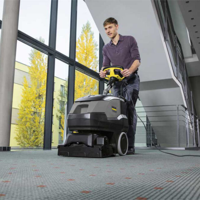 Office cleaning by a Karcher carpet extractor